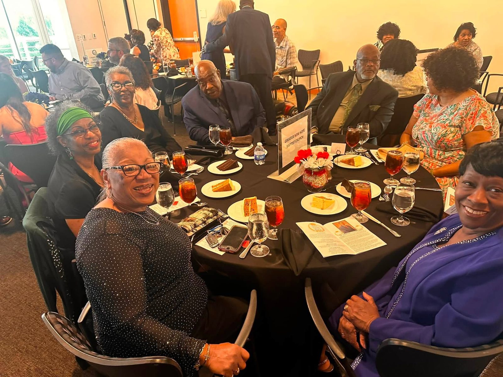 Attendees seated at banquet tables at Austin College