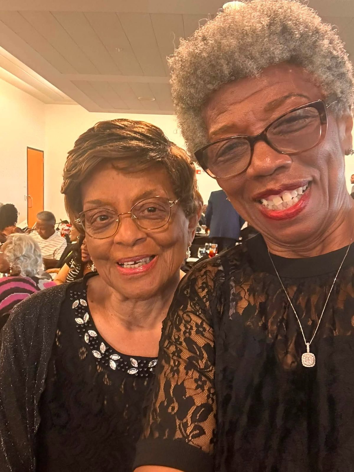 Two longtime members posing together during the banquet reception